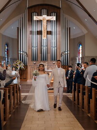 catholic couple celebrating after getting married at Immaculate Heart of Mary
Catholic Church in Griffin, Georgia