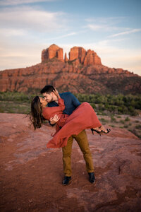 couple kissing after surprise proposal in sedona
