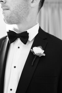 detail image of groom in tuxedo