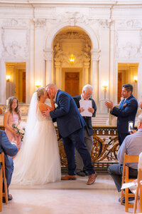 san francisco city hall wedding ceremony kiss
