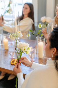 Woman attending bouquet workshop at Maison Charlottesville - photo by Jo Mahoney