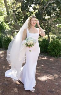 Bride poses for a portrait with hydrangea bouquet during Nantucket wedding.