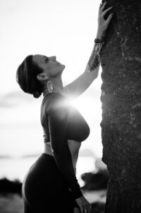 Boudoir experience outside sunflare under arm