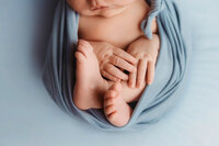 Newborn Pictures in Charleston - Infant posed for Newborn Pictures during Newborn Photoshoot at Holy City Babies Newborn Photography Studio in Charleston, SC.