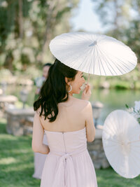 An unforgettable wedding moment surrounded by lush bougainvillea and golden light—captured with soft elegance by Los Angeles Top Destination Wedding Luxury Photographer Michael Asmussen. From Temecula Valley Wine Country to Tuscany, Italy this image embodies timeless beauty, couture bridal styling, and modern romance with a soulful lens.