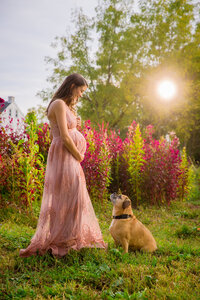 Mom-to-be with her dog at maternity session retouch