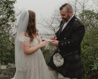 Couple reading their vows in the fog