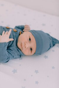 newborn baby looking at the camera