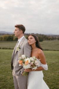 Bride and Groom with wedding bouquet by Flowergirl Cville. Photography by Brittany Stark Studios.