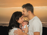 4Karma Studio - A heartwarming lifestyle newborn portrait with family at sunset in Los Angeles, featuring golden hour lighting and true-to-life colors.