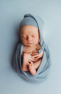 Newborn Pictures in Charleston - Infant posed for Newborn Pictures during Newborn Photoshoot at Holy City Babies Newborn Photography Studio in Charleston, SC.