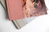 Close-up of premium photo album materials including linen and leather covers, Kaitlyn Dawn Photography, Yucaipa newborn and family photographer.