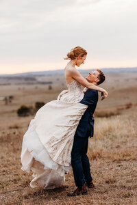 Bride and groom sunset portraits on the hill overlooking Petrichor Farm Gundaroo NSW
