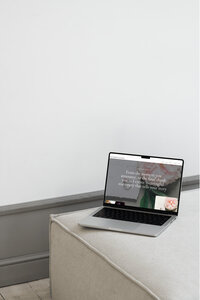 Services page of Showit website template for wedding stationery designers shown on laptop.