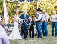 Azle Deer Cove, Bride and Groom during the ceremony with ring security