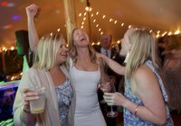 Guests enjoy dancing during tented wedding reception on Nantucket.