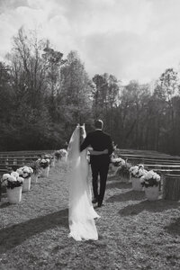 couple waking together down ceremony aisle at atlanta wedding