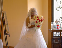 Venice Beach Los Angeles wedding photography of the bride walking down the aisle holding her bouquet, captured in a candid documentary moment with true to life color and soft natural light.