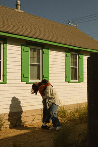 Couple hugging near homes in Cape Cod, Massachusetts.