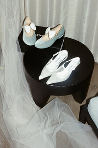 Film photography captures editorial bridal elegance at NOBU Hotel Chicago with fashion forward styling, demonstrating Lauren Alatriste's signature approach to luxury wedding photography combining timeless aesthetics with authentic emotion.