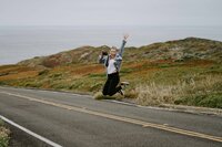 Northern California photographer jumping with camera
