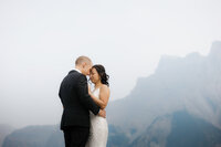 wedding day photos in the mountains at a lake in Canada