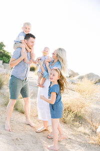 Image of family playing together taken by Sacramento Newborn Photographer Kelsey Krall Photography