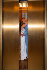modern bride and groom elevator kiss at san francisco city hall wedding