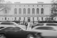 man and woman walking down street Downtown Detroit Engagement photography by Savvy Shoots Photography