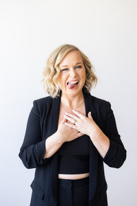Lis in a black suit