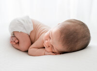 Sleeping infant during newborn session with Niceville family photographer