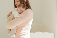 Canva - Mother Holding Newborn Baby