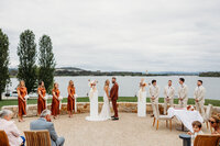 Wedding ceremony at the Marion overlooking Lake Burley Griffin on a cloudy day in Canberra ACT