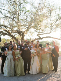 Wedding party at orange grove luxury wedding venue at sunset