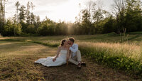 A couple shares a quiet, intimate moment at sunset, surrounded by warm golden light and breathtaking scenery. This romantic portrait captures genuine connection, natural emotion, and timeless love, making it perfect for engagement photography, anniversary sessions, or couples portraits. Ideal for those searching for sunset couples photography, golden hour engagement photos, and romantic outdoor photography in Maine and New England.