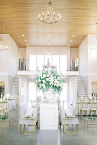 wedding reception with chandelier on wood ceiling