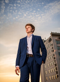 Senior portrait in downtown Mobile, Alabama— low angle high fashion pose looking off in the distance.