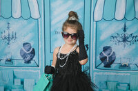 girl-in-black-tiffany-inspired-gown-and backdrop-wearing-sunglasses