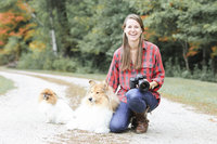 Photographer sitting with dog