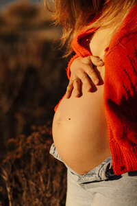 Pregnant woman at golden hour in Tekapo during a maternity session