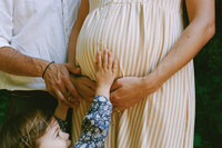 Child and pregnant mother together
