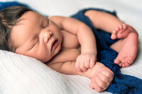 Close up newborn portrait with soft light and neutral styling in New Bern NC