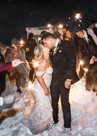 Couple doing a sparkler exit walk after their wedding at the Silcox Hut at Timberline Lodge