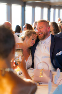 bride and groom on wedding cruise for reception in san francisco bay