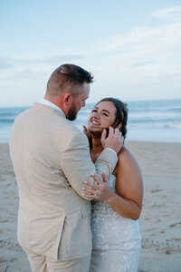 groom brushing his thumb against brides face
