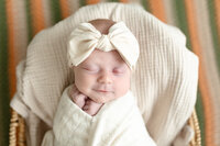 baby girl sleeping with a smile in Newborn Photographer Metro Detroit MI