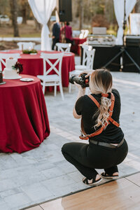 photographer taking a picture of wedding reception