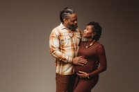 Expectant parents pose for studio Maternity Portraits at Holy City Babies Portrait Studio in Charleston, SC.