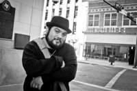 San Antonio Photographer David Castillo standing downtown at Main Plaza after a photoshoot
