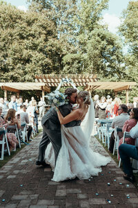 Bride and groom during barn wedding ceremony at Mason Farms in North Georgia, shot by Crimson Conure Photography based in Denver, Colorado and Kennesaw, Georgia